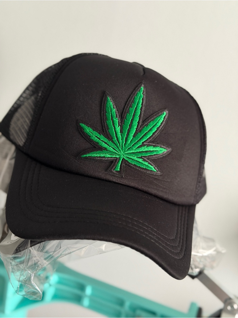 Black Trucker Cap with Green Leaf Embroidery